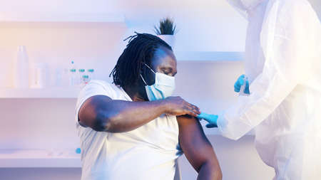Young african man getting vaccineの写真素材
