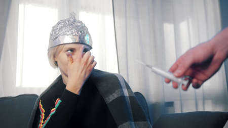 Woman with aluminum foil refusing  vaccine.の素材 [FY310166629887]