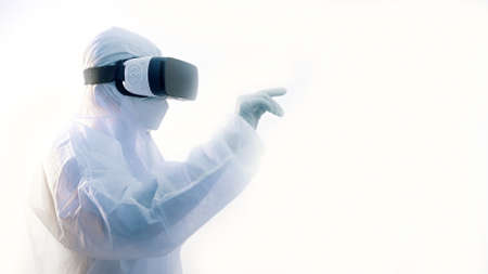 Futuristic laboratory. Doctor in protective suit with VR glasses performing research in virtual...