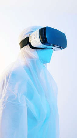 Telemedicine Concept. Doctor or scientist with VR glasses working using simulation technology. High quality photoの写真素材