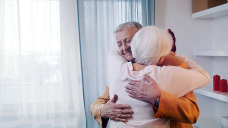 Happy elderly couple dancing in the hotel room. Love and dating at old age. High quality photoの写真素材