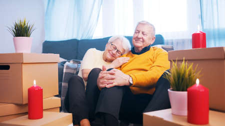 Happy retired couple enjoying valentines day with candle lights. Love romance and dating at old age. High quality photoの写真素材