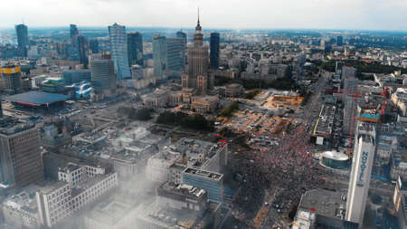 Warsaw, Poland 08.01.2019 - Drone shot of city stops to pay respect to fallen heroes, Godzina w. Misty weather with high-rise buildings in the background against the blue sky.のeditorial素材