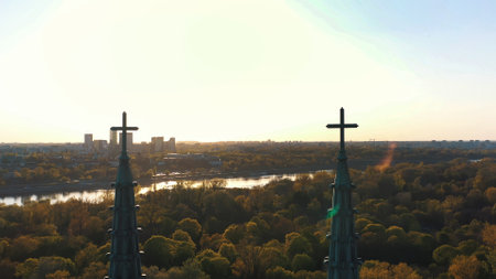 Warsaw, Poland 12.01.2020 - Picturesque view of the facade of Cathedral of St. Michael the Archangel and St. Florian the Martyr against the cloudy blue sky. Grove of trees can be seen in the background.の写真素材
