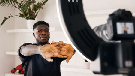 African american black man warming up his hands in front of the camera. High quality photo