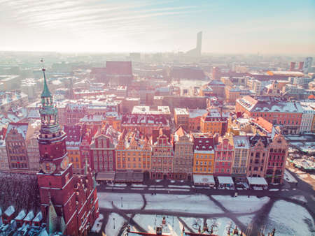 Panoramic View of Main Market Square also called Rynek against blue sky with sun rays in the city of...