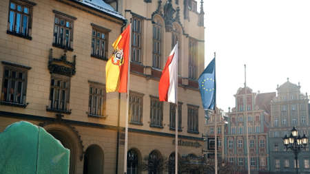Krakow, Poland 03.02.2021 German and European Union Flags near a facade of the embassy building in...