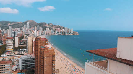 Benidorm, Spain 18.08.2021 Benidorm city aerial shot with mountains in the background. Mediterranean coast landscape located in the Valencian community in the city of Benidorm, Alicante, Spainのeditorial素材