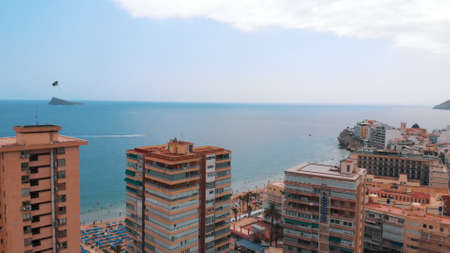 Benidorm, Spain 18.08.2021 - Coast of Benidorm A unique Spanish resort town with skyscrapers on the Mediterranean coast. Picturesque blue cloudy sky in the background. Serene view.のeditorial素材