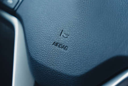 inside the car a view of the plastic airbag protection with letters without a logo. High-quality photoの写真素材