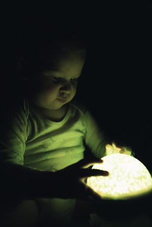 Building memories with toddler. Childs curiosity caught on camera. Vertical shot. High quality photoの写真素材