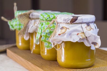 Honey in jar with fir cone aroundの写真素材
