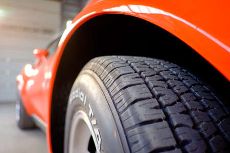 Orange sport car with detail wheel, tiresの写真素材