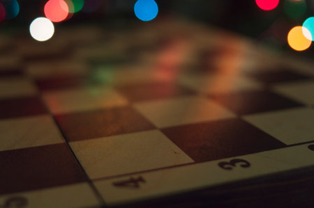 wooden chessboard on color lights backgroundの写真素材