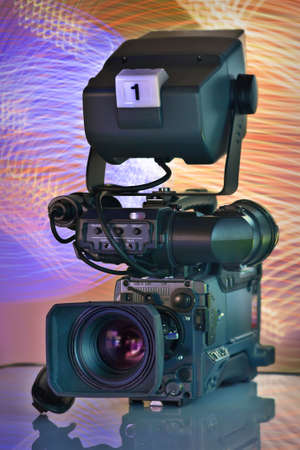 Professional video camera on a color freezlite backgroundの写真素材