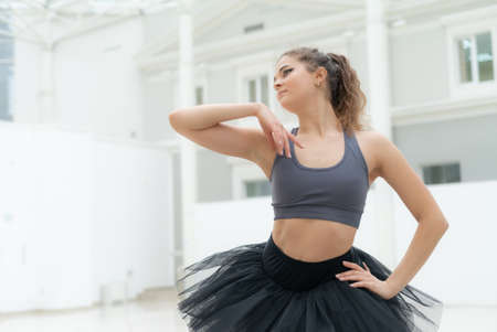 Beautiful flexible slender young girl ballerina. Ballet