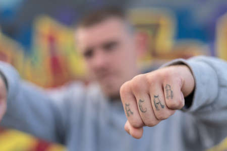 ACAB tattoo on the arm of a bully manの写真素材