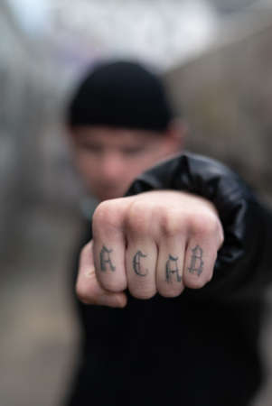 ACAB tattoo on the arm of a bully manの写真素材