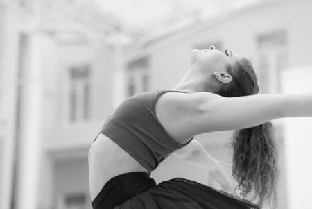 Black and white photo of flexible slender young girl ballerina. BWの写真素材