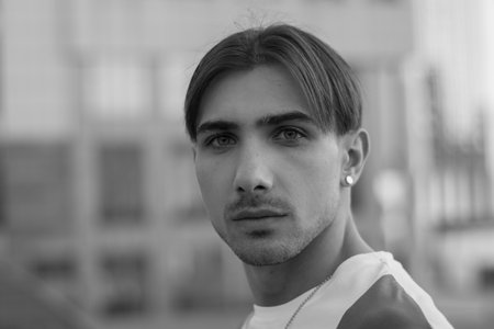 Portrait of a gay man - member of the LGBTQ community. Black and white photo. BW
