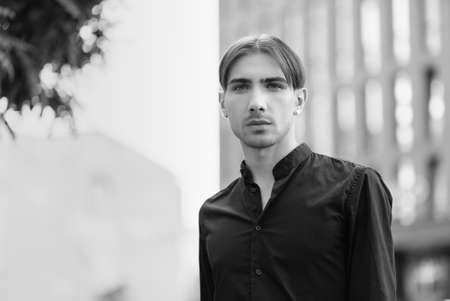 Portrait of a gay man - member of the LGBTQ community. Black and white photo. BW