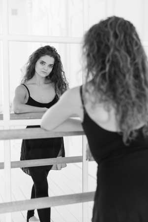 Girl ballerina with curly hair. Black and white photo. BWの写真素材