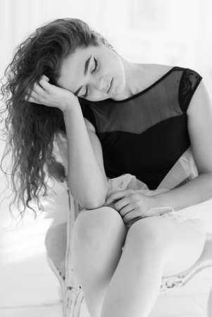 Girl ballerina with curly hair. Black and white photo. BWの写真素材