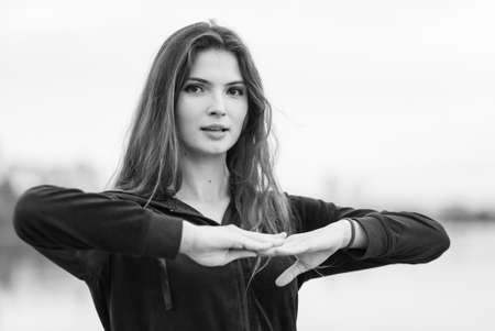 Sports and healthy lifestyle : Brunette girl doing sports exercises. Black and white photo. BWの写真素材
