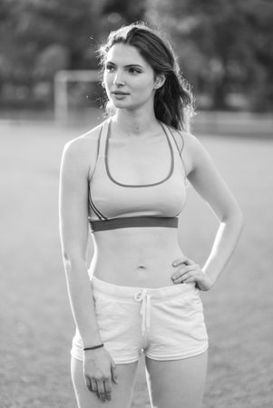 Portrait of a beautiful young sporty brunette girl. Black and white photo. BWの写真素材