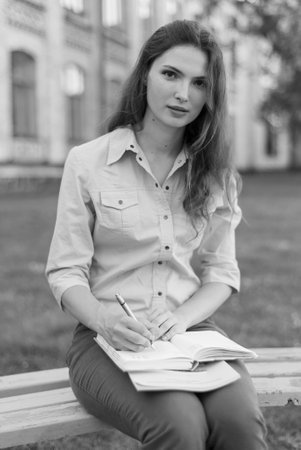Young beautiful girl student in shirt. Black and white photo. BW