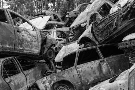 Dump of war-destroyed cars in Ukraine, black and white photoの写真素材