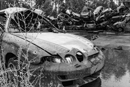 Shot and burned cars during the war in Ukraine, black and white photoの写真素材