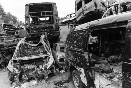 Black and white photo of the war in Ukraine - destroyed cars in Bucha districtの写真素材