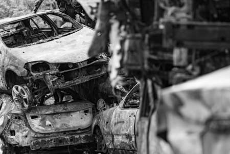 Dump of war-destroyed cars in Ukraine, black and white photoの写真素材