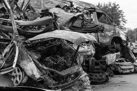Shot and burned cars during the war in Ukraine, black and white photoの写真素材