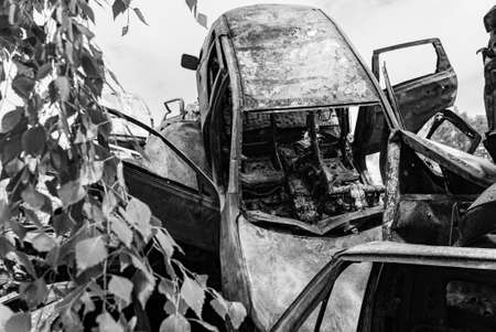 Black and white photo of the war in Ukraine - destroyed cars in Bucha districtの写真素材