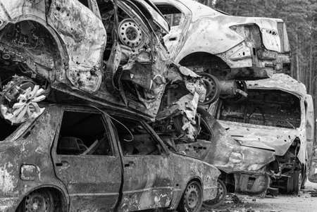 Dump of war-destroyed cars in Ukraine, black and white photoの写真素材