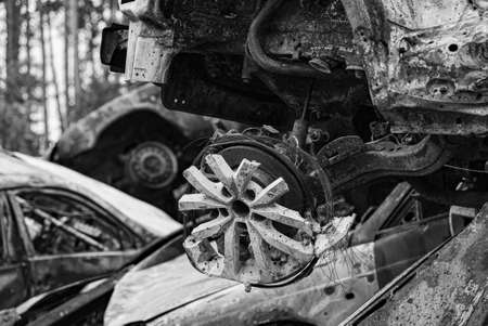 Black and white photo of the war in Ukraine - destroyed cars in Bucha districtの写真素材