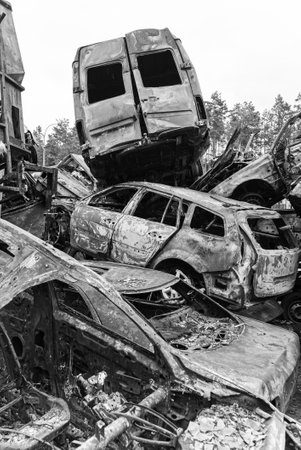 Shot and burned cars during the war in Ukraine, black and white photoの写真素材