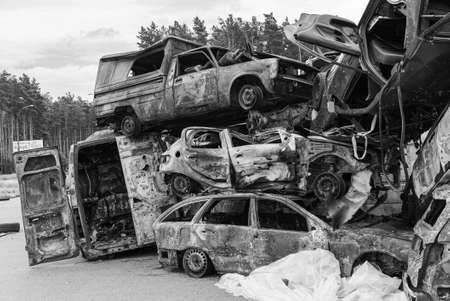 Dump of war-destroyed cars in Ukraine, black and white photoの写真素材
