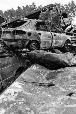 Shot and burned cars during the war in Ukraine, black and white photoの写真素材