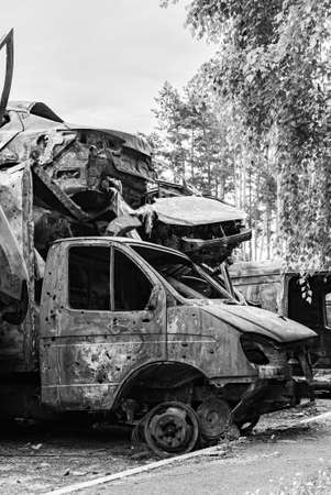 Dump of war-destroyed cars in Ukraine, black and white photoの写真素材