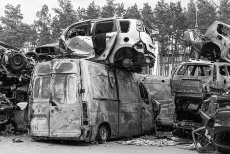 Shot and burned cars during the war in Ukraine, black and white photoの写真素材