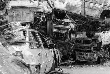 Dump of war-destroyed cars in Ukraine, black and white photoの写真素材
