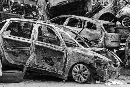 Shot and burned cars during the war in Ukraine, black and white photoの写真素材