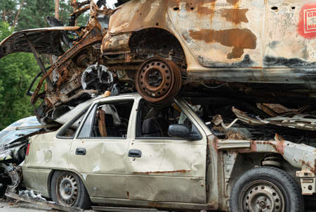 Consequences of the war in Ukraine - destroyed cars in Irpin, Bucha district.の写真素材