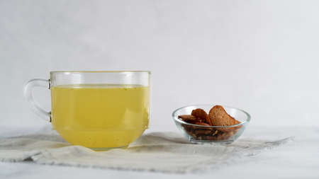 Homemade chicken bone broth in glass cup with croutons. Healthy eating.の写真素材