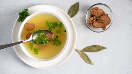 Taste the homemade chicken bone broth. Collagen is good for joints.の写真素材