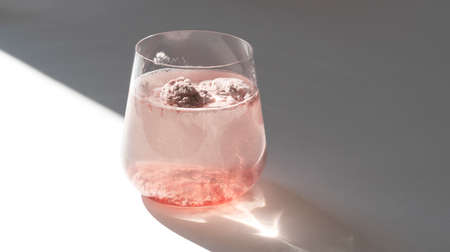 Glass of strawberry collagen in glass of water for skin care. Food additives.の写真素材