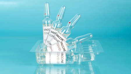 Coronavirus sars-cov-2 vaccine vials. Covid-19 vaccination with vaccine ampoules. Vaccine against...